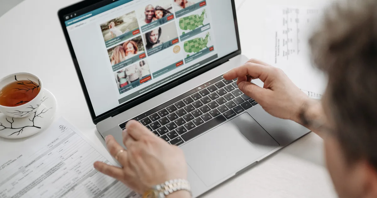 Woman applying for Alphaeon Credit online with laptop