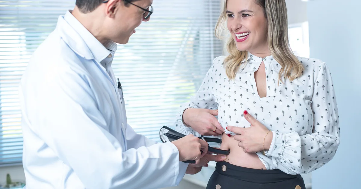 Patient consulting a surgeon about bariatric financing