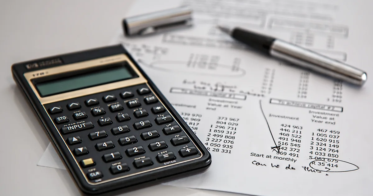 Patient calculating Alphaeon Credit deferred interest payments on laptop