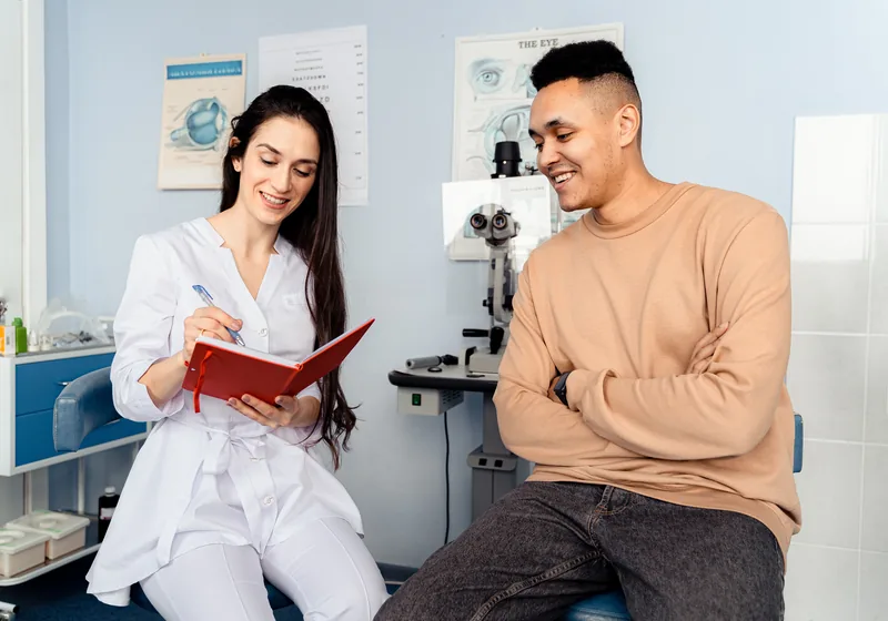 Doctor consulting a patient about Alphaeon Credit healthcare financing options
